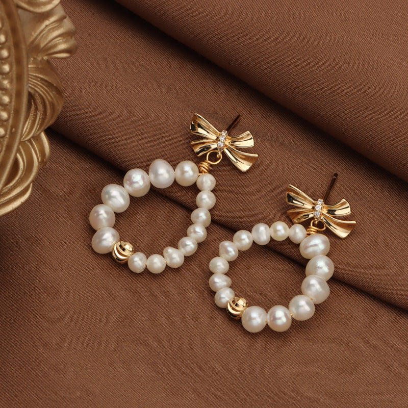 Bow pearl stud earrings